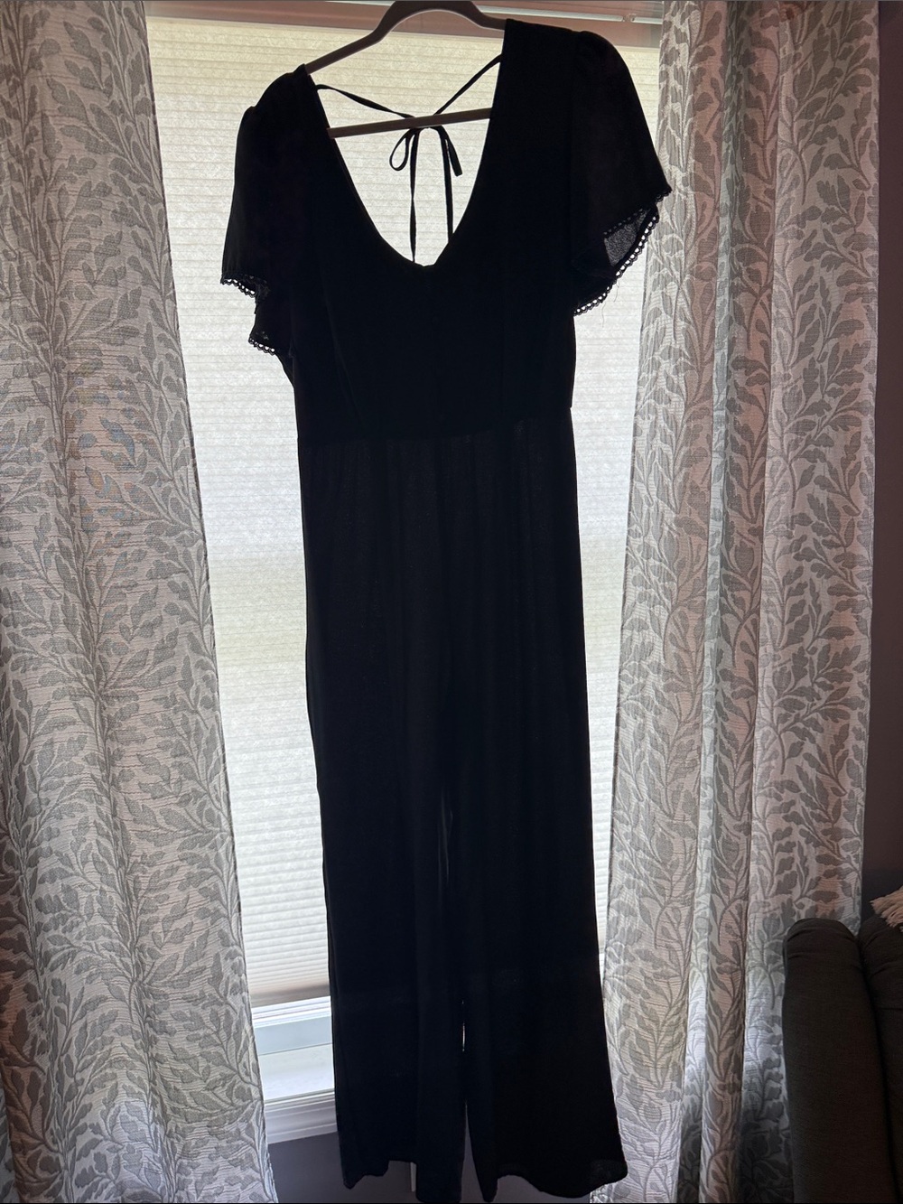 Trixxi One-Shoulder Black Jumpsuit with Flutter Sleeve Detail